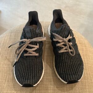 Size 8.5 Adudas Ultra Boost gym shoes.  Worn once.  Excellent condition.
